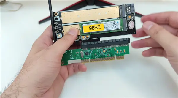 PCI-to-PCIe adapter card with PEX 8112 bridge chip enabling NVMe on Intel Pentium II platform