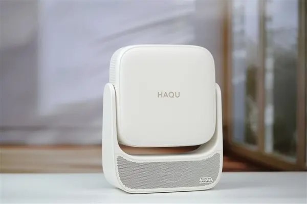 Harman tuned speaker system integrated into Haqu H3 Pro projector for immersive audio without external equipment.