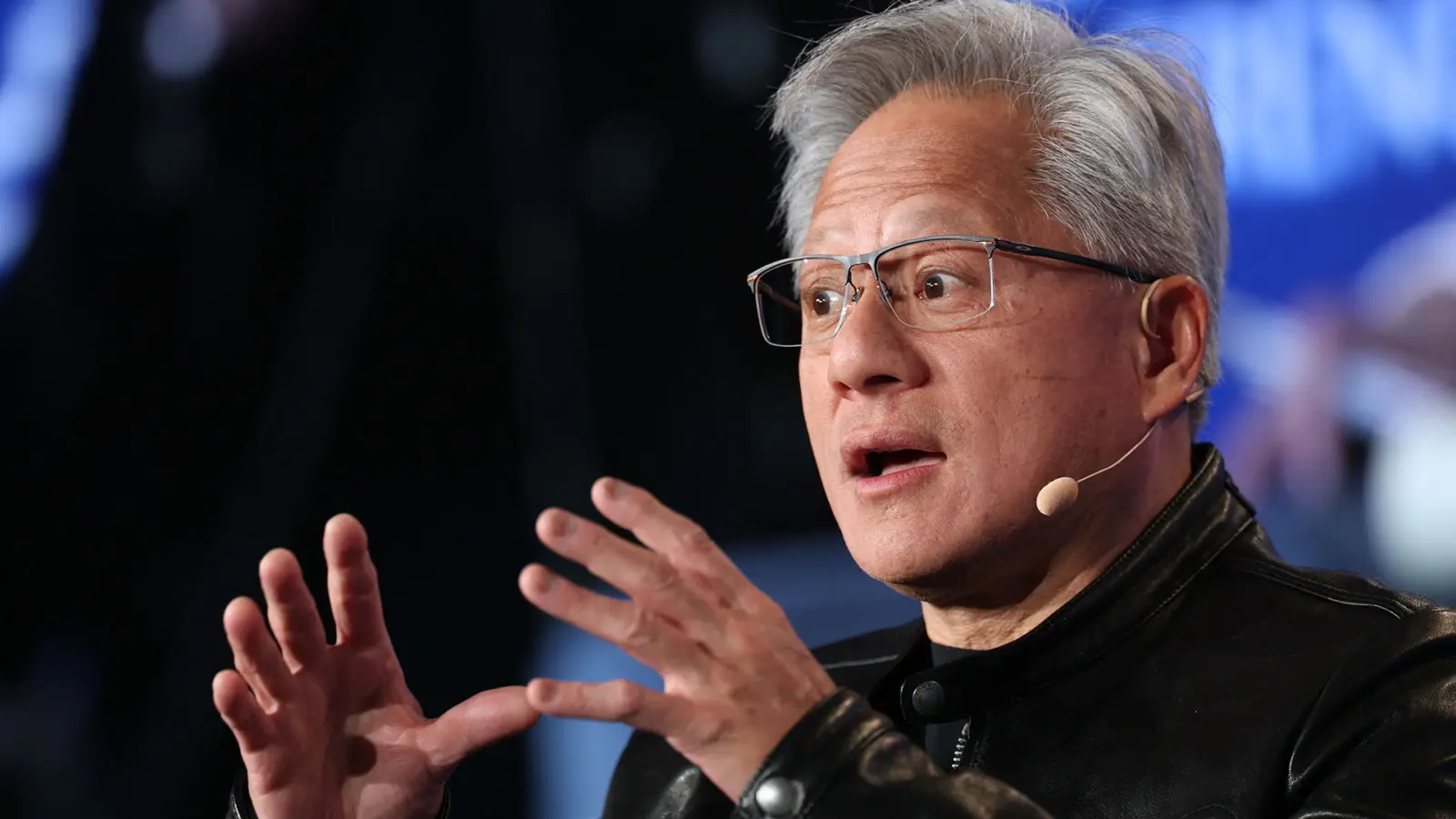 Nvidia CEO Jensen Huang confirms H200 chip licensing to China during regulatory compliance address at Songshan Airport.