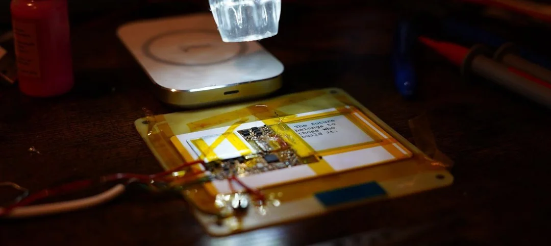 Close-up of credit-card computer showing flexible PCB and battery