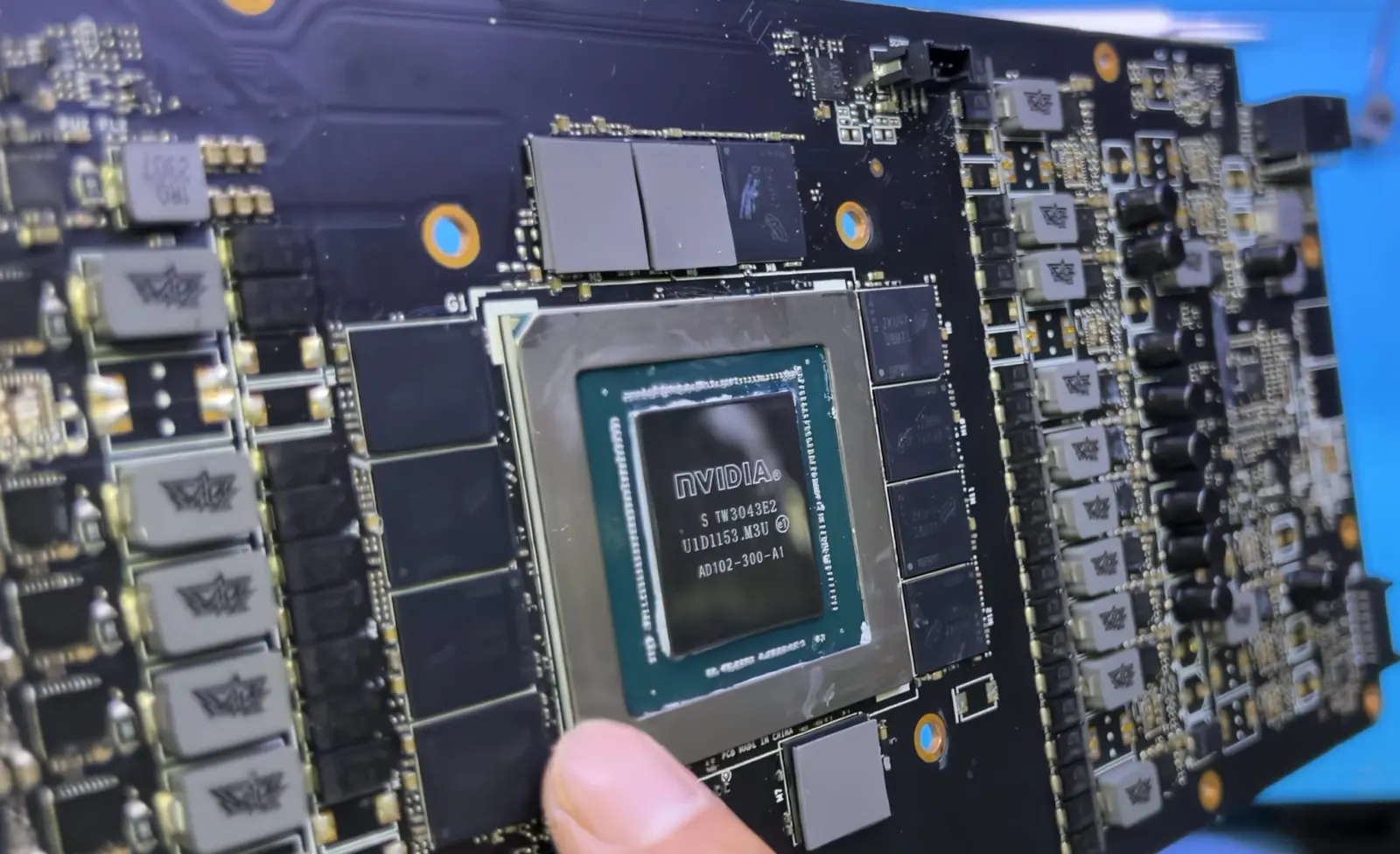Close-up of a counterfeit graphics card with visible plastic GPU die