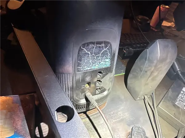 Damaged router and PC motherboard after lightning strike via coaxial cable