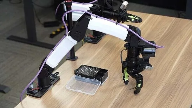 Robot installing graphics card into PCIe slot