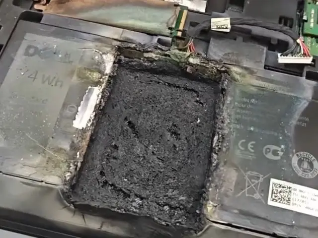 Dell gaming laptop with burned-through bottom chassis