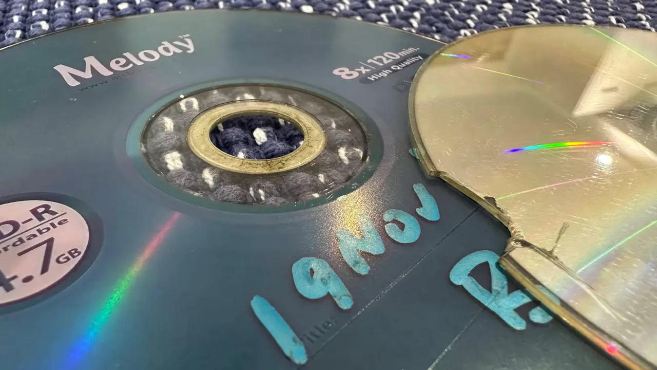 Destroyed CD-ROM showing physical degradation