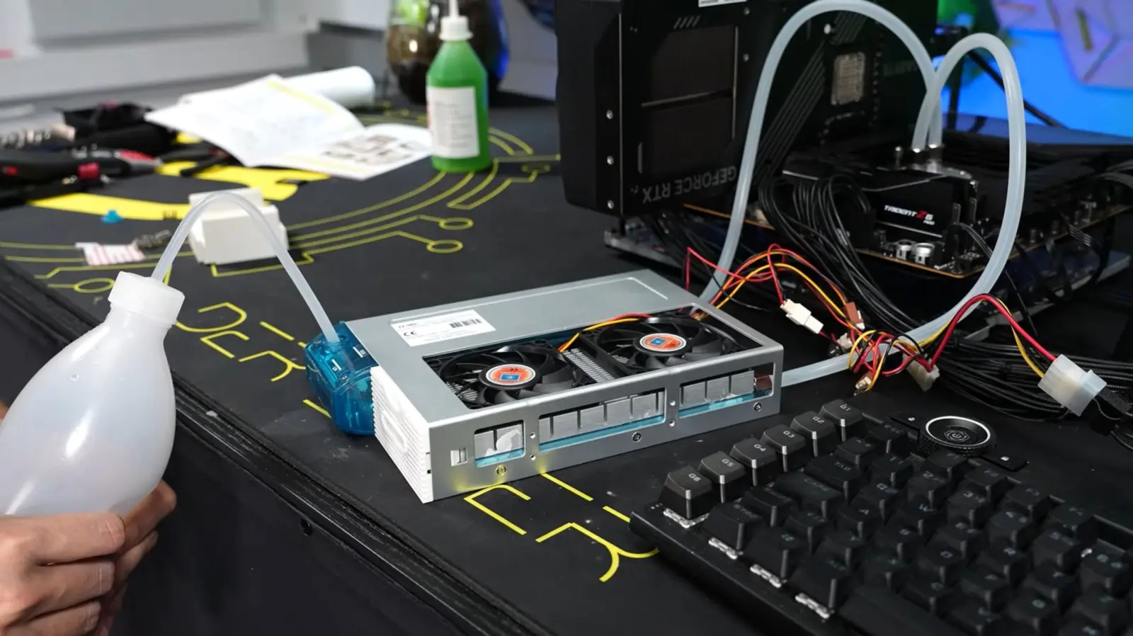 Q-Tec KS70 liquid cooler mounted on AMD Ryzen 7 9800X3D with custom adapter