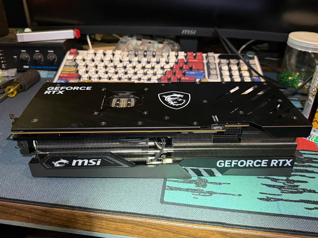 Disassembled graphics card showing missing GPU core and VRAM chips